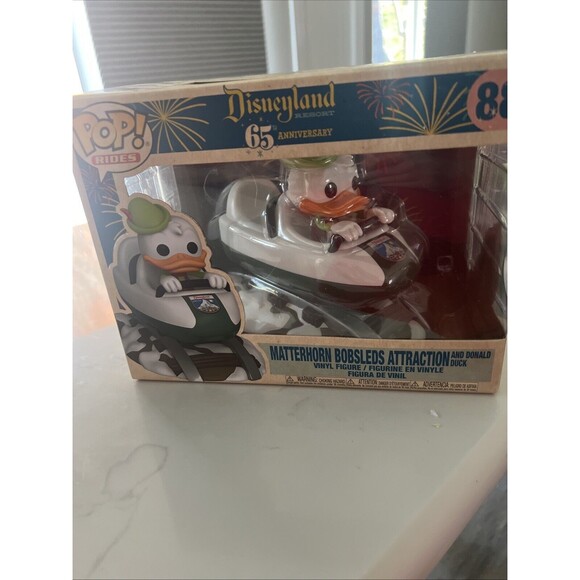Disneyland 65th Anniversary - Matterhorn Bobsleds Attraction and Donald Duck Pop! Rides Vinyl Figure